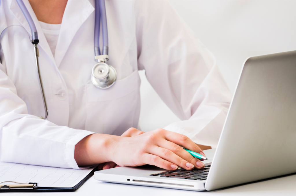 doctor-with-stethoscope-using-laptop-desk_7.png